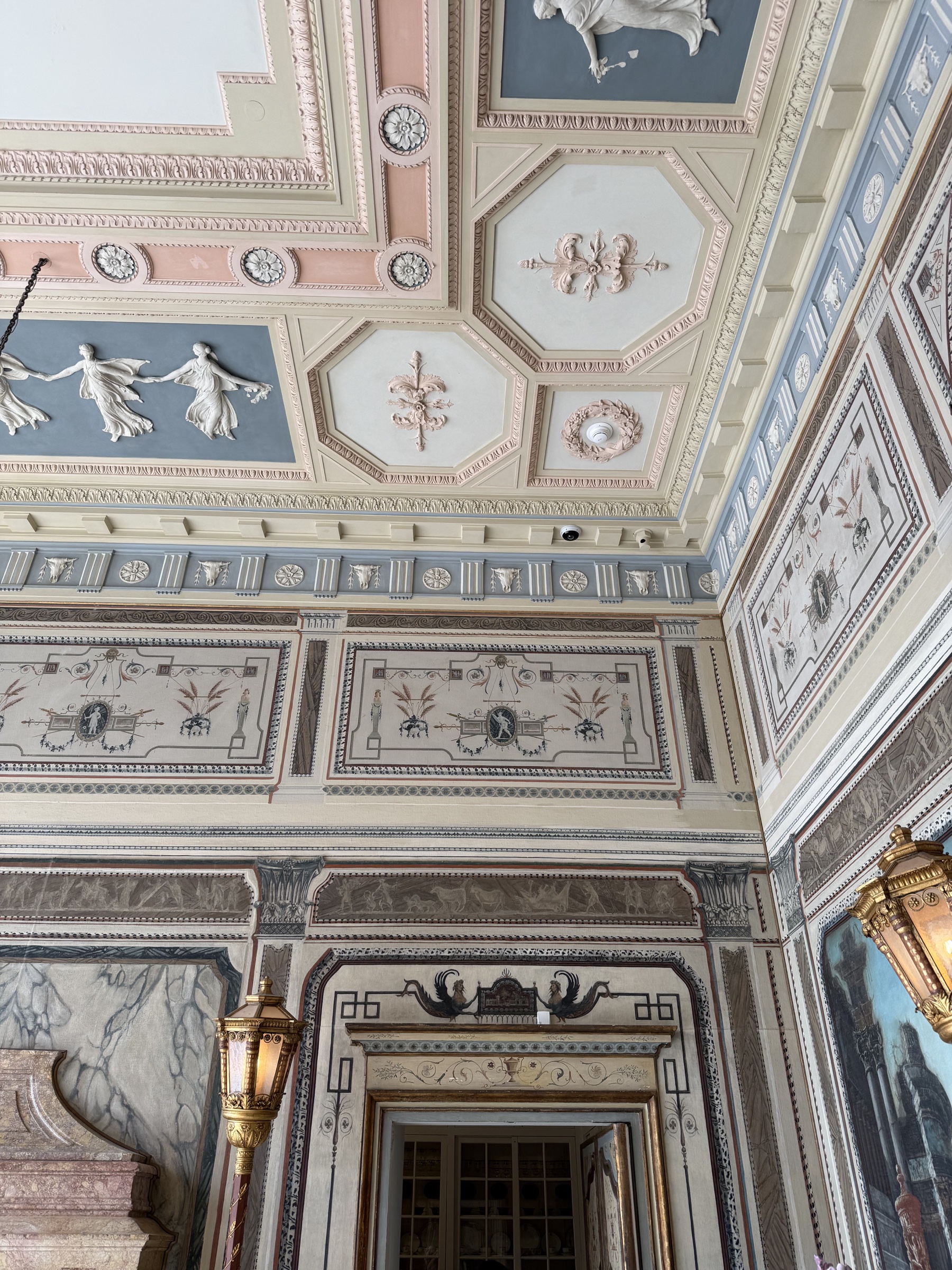 Ornate pale pink and blue painted ceiling and walls